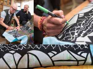 Stanley Donwood signs the tapestry